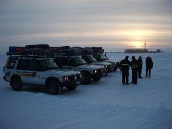 4 workers vehicles sunset arctic.jpg